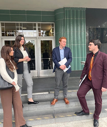 From left: Adrianne Davies, Gabi Rosenfeld and Owen McAleer with Mark Rossow, legislative director for Assemblymember Wilson’s office. (Photo by Beth Kent)