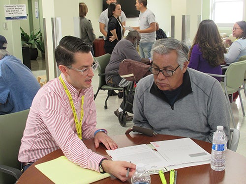 A member of the Veterans Legal Clinic working with a client