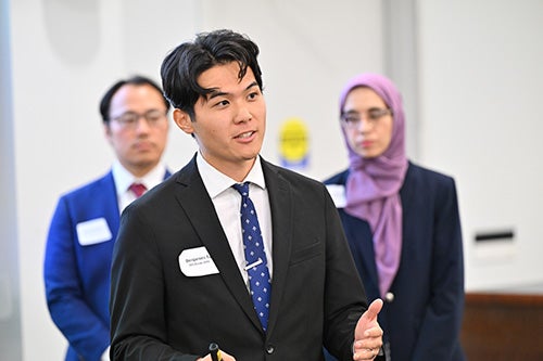 A student talking during the LMI-Sandler competition.