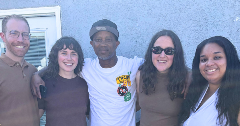 Joseph Turner (center) with Resentencing Practicum program director Josh Weiss and students Cathy Balfe ’26, Tori Funk ’26, and Destinee Dickson ’26.