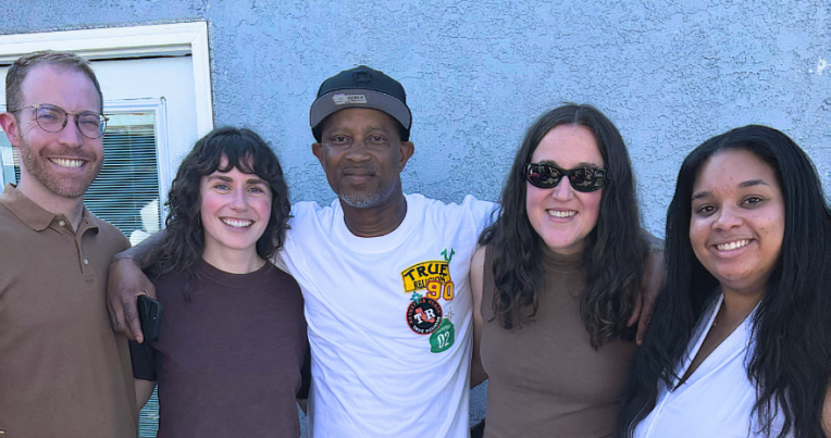 Joseph Turner (center) with Resentencing Practicum program director Josh Weiss and students Cathy Balfe ’26, Tori Funk ’26, and Destinee Dickson ’26.