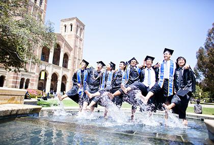 Graduates dancing tin the Shapiro fountain
