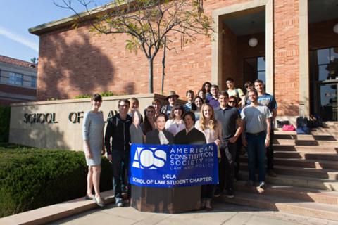 ACS group outside with banner