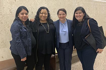 Law students Emma Hulse and Yesenia Pulido in L.A. Superior Court with client and mother after a successful hearing for Special Immigrant Juvenile Status.