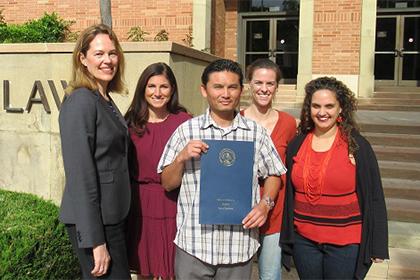 Members of UCLA Law's Criminal Defense Clinic stand with their client Phal Sok.