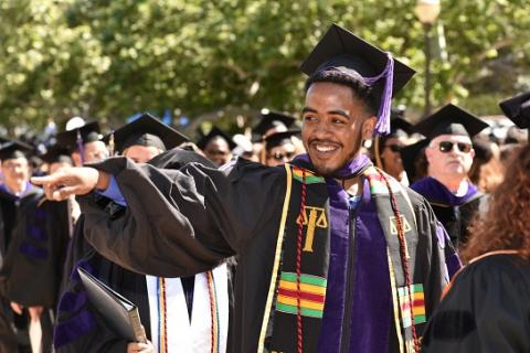 UCLA Law J.D. class president Curtis Harris ’19, leads the procession of graduates at the school’s 68th commencement ceremony.